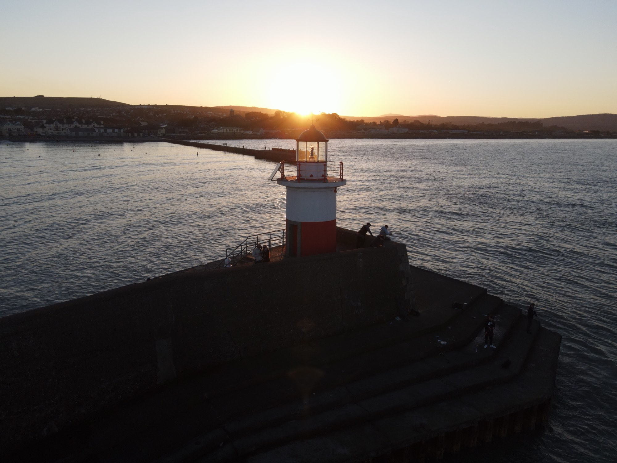 Wicklow Harbour lighthouse pier at golden hour near Black Castle, County Wicklow, Ireland — YouIn360 360° virtual tour