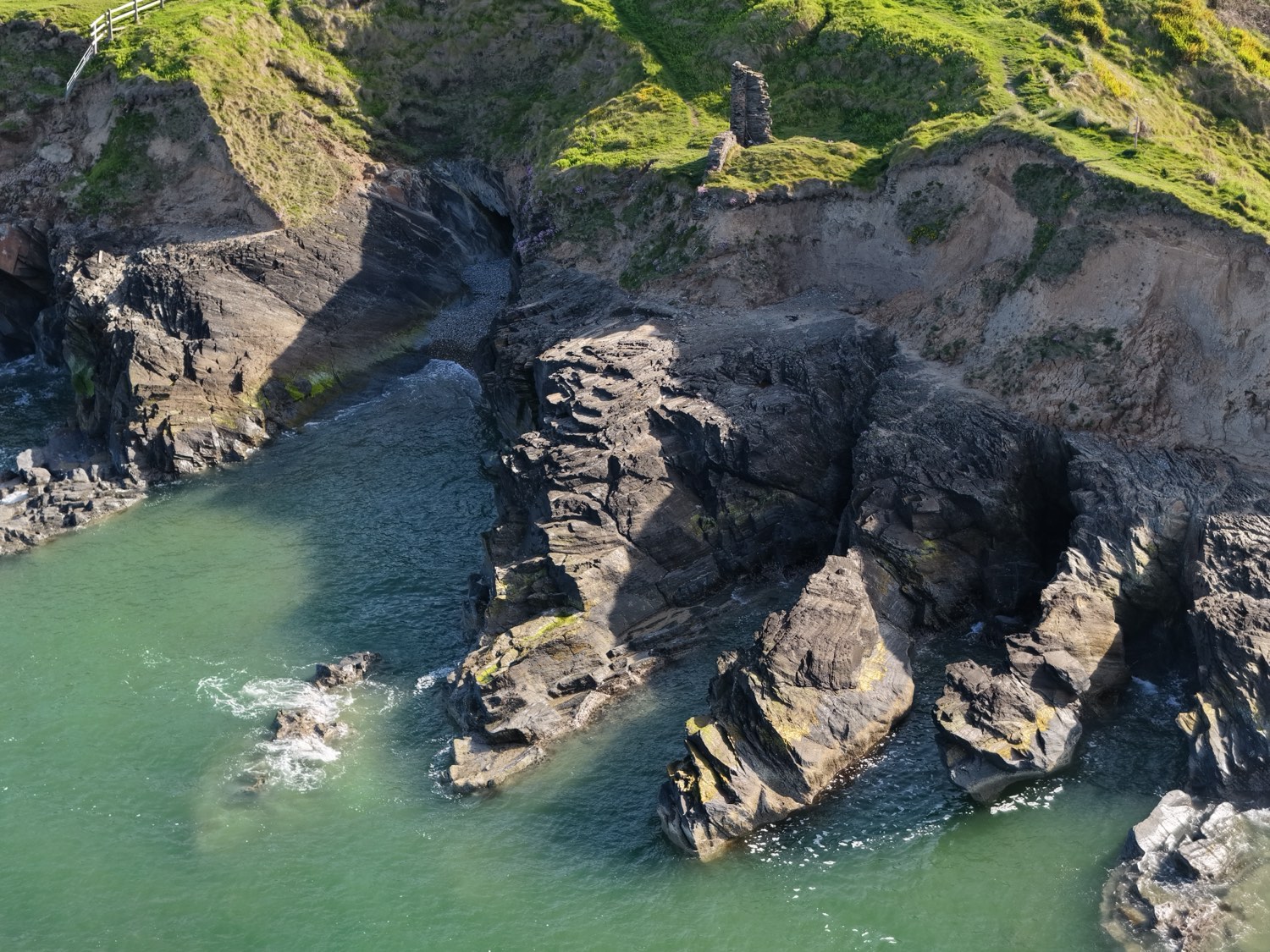 Turquoise cove and rocky cliffs at Kilmichael Point